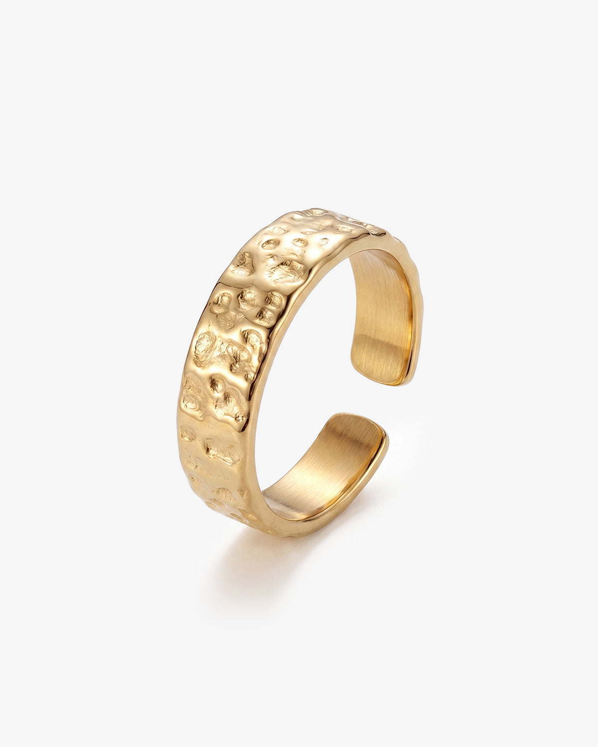 Hammered gold 6mm ring with textured surface on a man's finger.