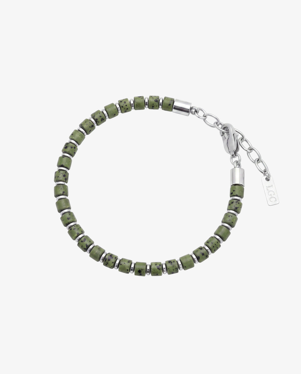 Green lava stone bracelet with small silver spacers on a man's wrist.