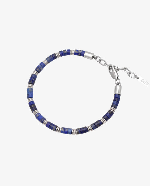 Lapis bead bracelet with blue stones, silver spacers, and a metal clasp