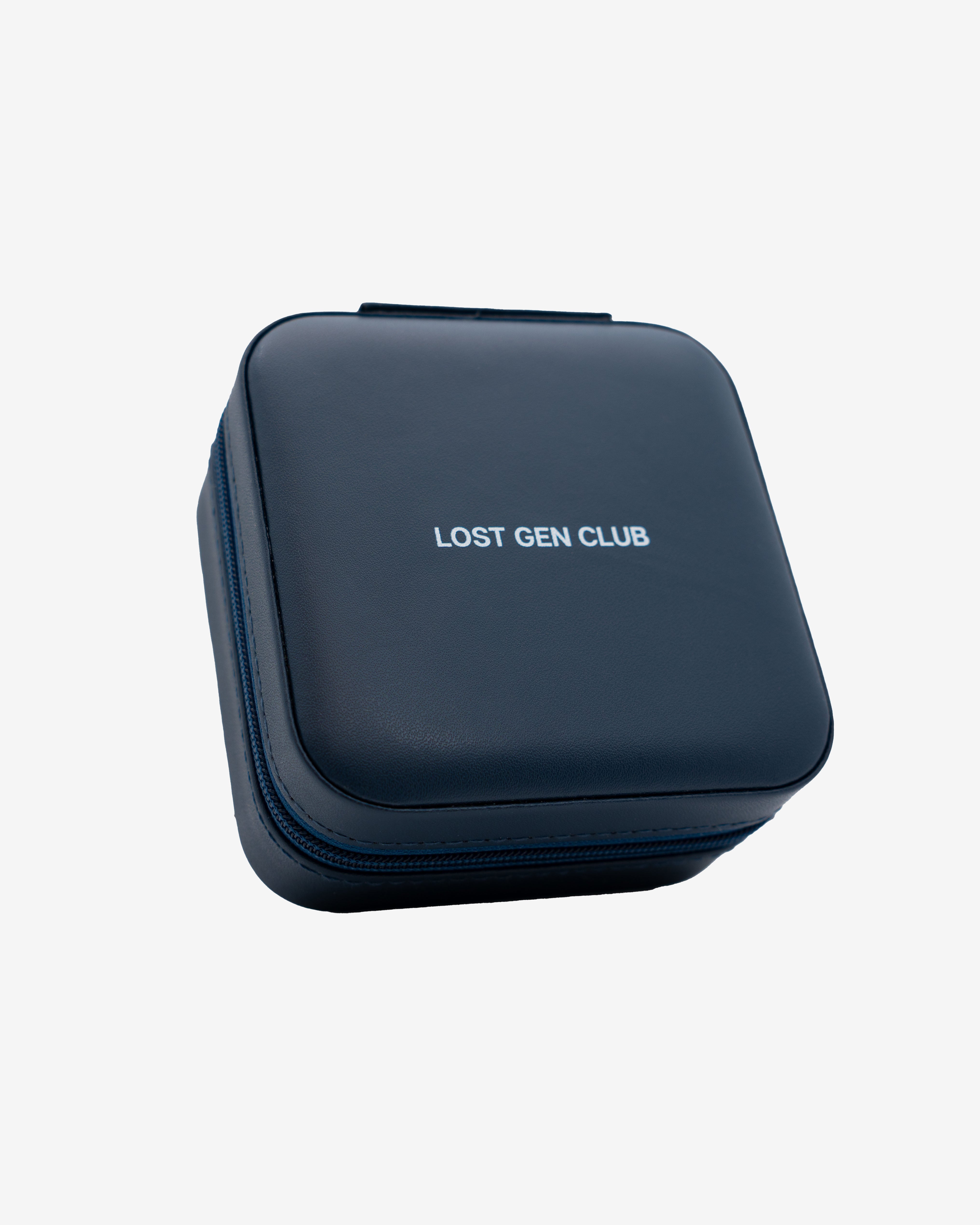 Blue travel jewelry case with leather texture and Lost Gen Club branding on the lid
